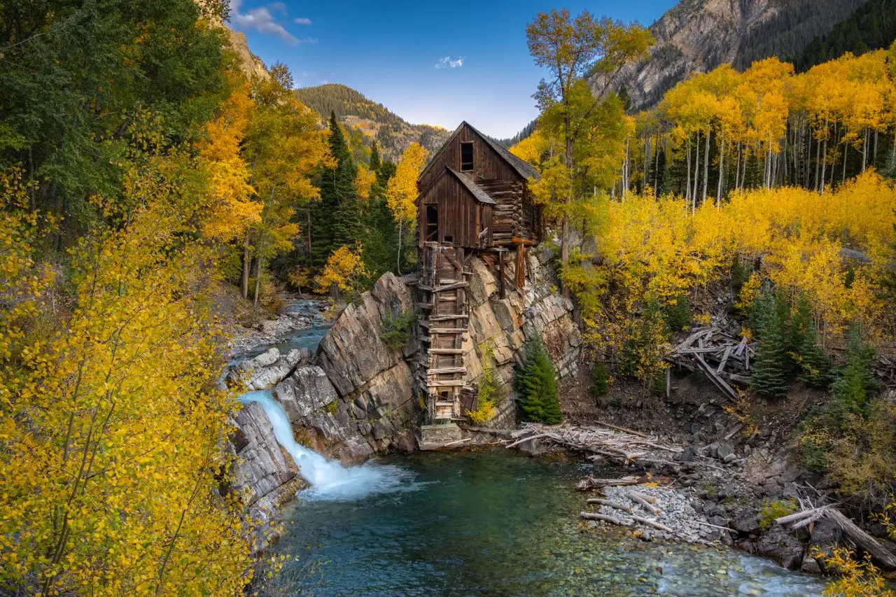 Historic Crystal Mill surrounded by vibrant fall colors in Carbondale, Colorado